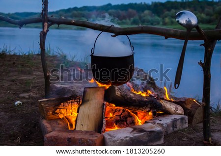  camping cauldron. cauldron at the stake. rest by the river. High quality photo