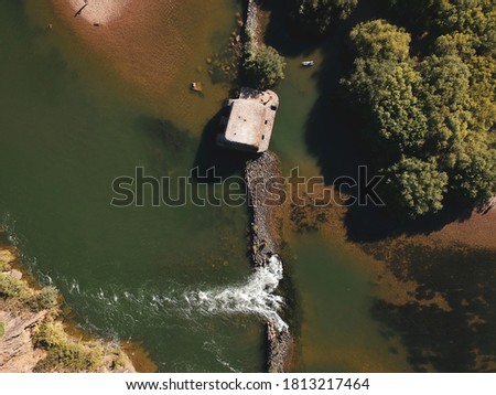 Aerial view from a river with an old water mill. Guadiana River