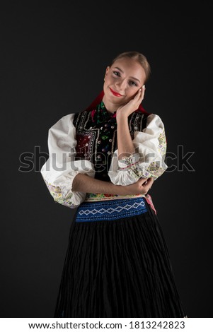 Beautiful woman wearing traditional Eastern Europe folk costumes. Slovak folk costumes.