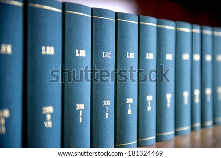 Law books in al law office's bookshelf.