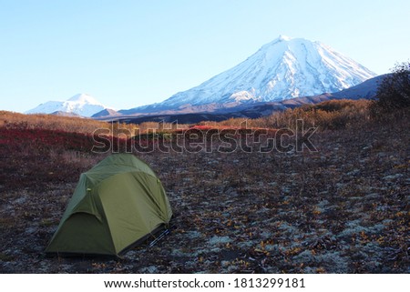Autumn in Kamchatka, tourism tent on the background of volcanoes