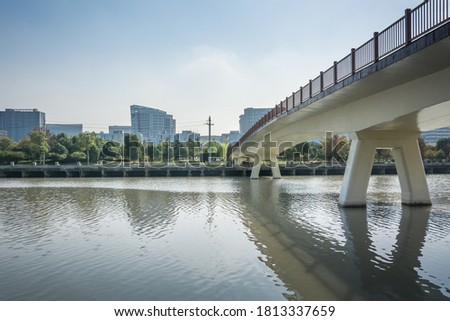 Modern city by the river and bridge