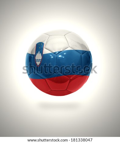 Football ball with the national flag of Slovenia on a gray background