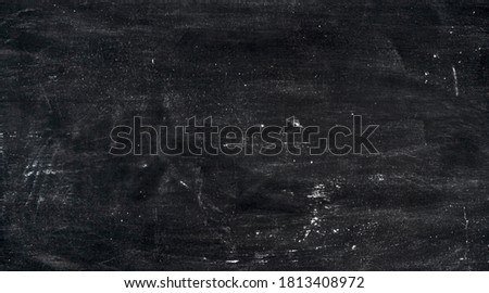 Abstract background. Wheat flour spots on old black baking sheet. Top view Royalty-Free Stock Photo #1813408972