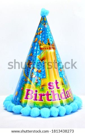 Blue Colored Hat with sponge balls for the First birthday celebration.