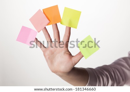 female hand with five paper stickers on her fingers