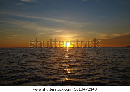 Sunset on pacific ocean beautiful cloudy sky