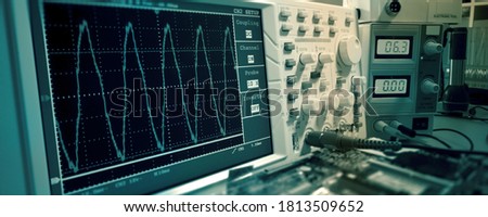 Measurement of a waveform with an oscilloscope Royalty-Free Stock Photo #1813509652