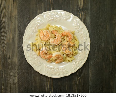 Linguini pasta with a creamy buttery sauce with scallops and jumbo shrimp.