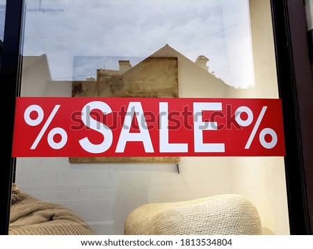 Shop Window With Red Sale Sign
