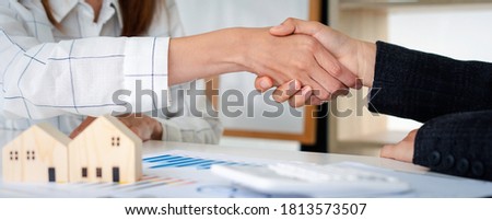 Real estate agents shakehands to congratulate clients on accepting the offer to buy a home at a special price, home lease contract concept. And trading houses