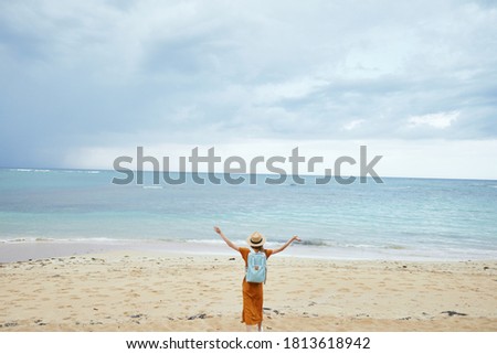 woman tourist backpack travel walk beach island landscape ocean 