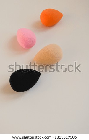 Closeup photo of colorful cosmetic beauty blenders on a white background. Make up sponge