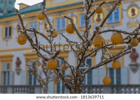 yellow glass balls on a metal tree