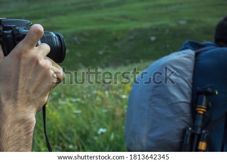 photographer takes pictures in the wild with a camera