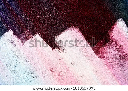 Plaster in different colors, the wall in multi-colored lights. Background for design and presentations