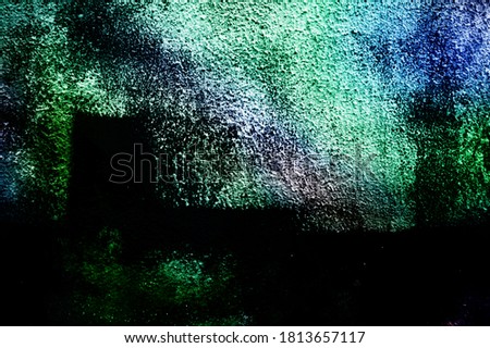 Plaster in different colors, the wall in multi-colored lights. Background for design and presentations
