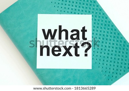  text it what next with you available written on a blue background and notepad. High quality photo