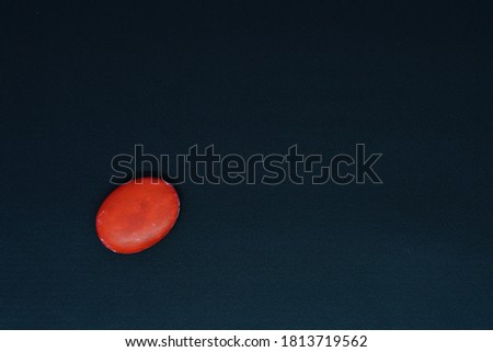 Beautiful red stone on black background
