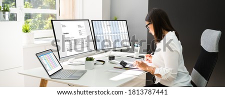 Online Taxes And Invoice Using Computer And Calculator Royalty-Free Stock Photo #1813787441