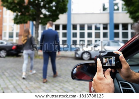 Private Detective Spying. Investigation And Surveillance With Camera Royalty-Free Stock Photo #1813788125