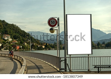 vertical billboard on a street in Switzerland, in Ticino on Lake Lugano