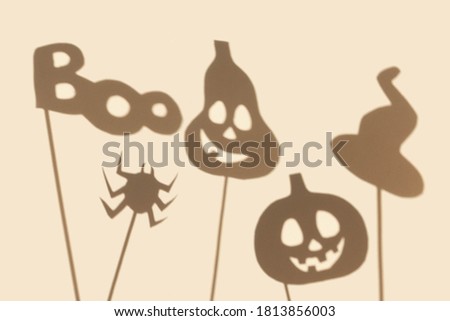 Collection of eye shadows with pumpkins, spider and the inscription boo on a white background. Halloween concept