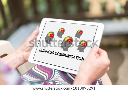 Business communication concept shown on a tablet held by a woman