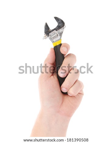Adjustable wrench in a man's hand. Isolated on a white background.