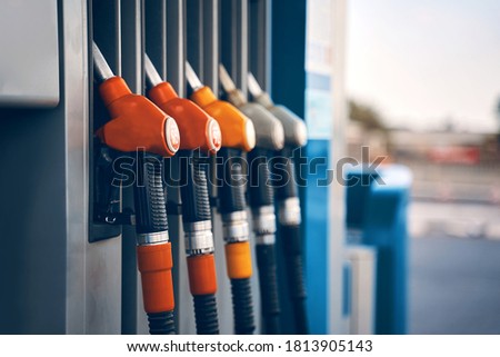 Colorful gasoline dispenser background. Fuel pumps service station , copy space. Royalty-Free Stock Photo #1813905143