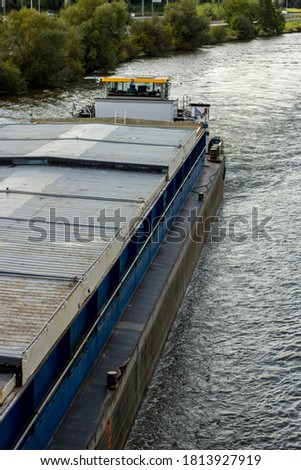 Big boat transporting goods on river.
