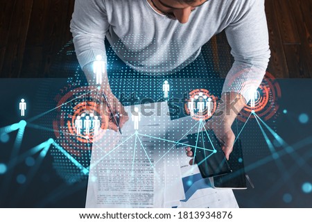 Handsome man sign SMM contract to promote personal brand project. Multiexposure. Social network hologram. Royalty-Free Stock Photo #1813934876