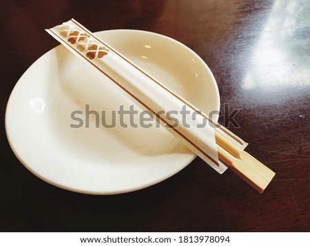 Plates and chopsticks Get ready for Japanese food. The laid-back, relaxed atmosphere enhances the flavor of the meal.
