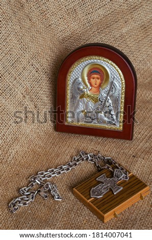 Icon of the Archangel Michael, pectoral cross and wooden joke on sackcloth. Christian icon with silver and gilding. Solid silver pectoral cross with a chain. Orthodox Church.