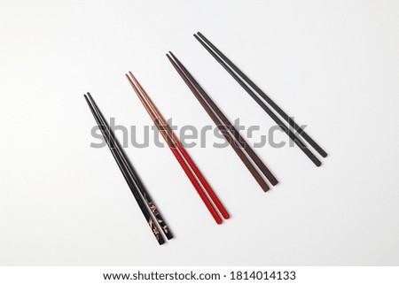 disposable beech wooden chopsticks put together isolated on white background