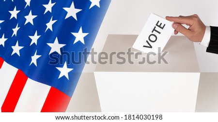 Voting in the American Presidential election. The American puts his ballot in the ballot box. Voting at a polling station in the United States. Ballot box on the background of the flag of America.