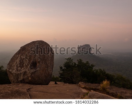 View of the surrounding hills and Sigiriya rock fortress from the top of Pidurangala rock at sunrise