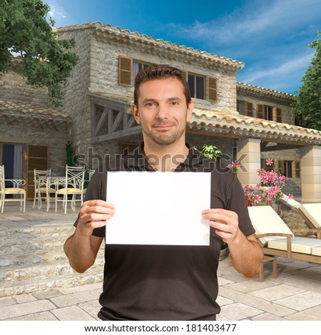 Man holding a blank, customizable message by a beautiful house