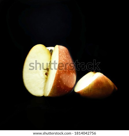 Background image of an apple with black background. 
