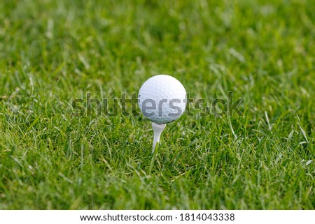 Golf ball in golfer's hand. 