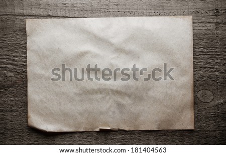 old paper on dirty wooden background