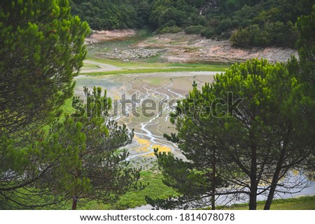 Water drains near lake Kemerburgaz Kent Orman, Turkey. Photo is taken from a hill in a park.