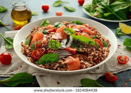 Buckwheat salad with smoked salmon, cherry tomato, red onion and greens