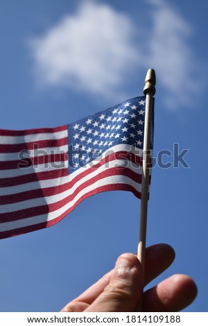 American flag waving in a blue sky