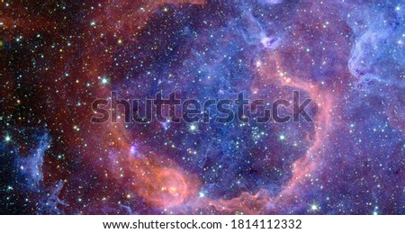 Astronomy graphic design background with nebula and glowing stars in deep universe. Abstract image. Elements of this image furnished by NASA.