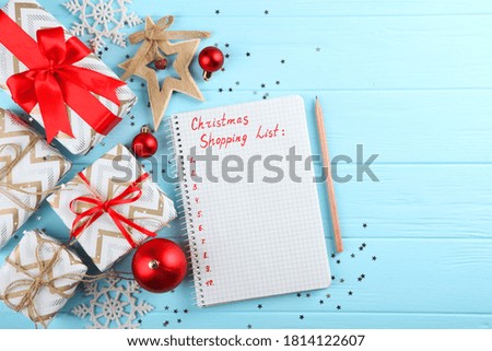 Christmas shopping list. Composition on the theme of christmas shopping top view