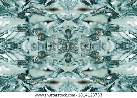 Bright beautiful symmetrical voluminous glowing optical pattern, kaleidoscope