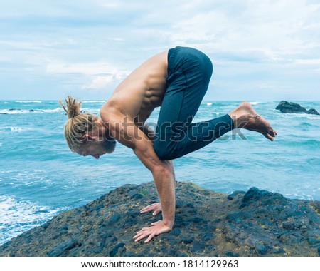 Athlete man practicing on a rock 