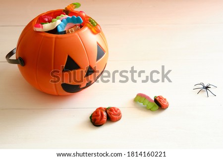 Halloween candies on white wooden table