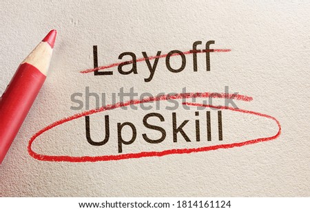 Upskill text circled in red pencil below Layoff, workforce retraining concept                                Royalty-Free Stock Photo #1814161124